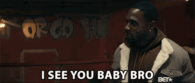 a man in a boxing ring says " i see you baby bro " to another man