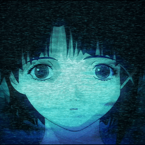 a close up of a girl 's face in a dark room