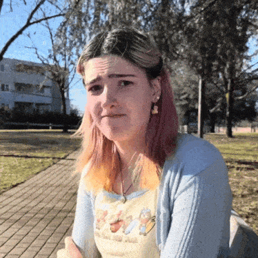 a girl with pink hair is wearing a shirt that says ' i 'm your own food '