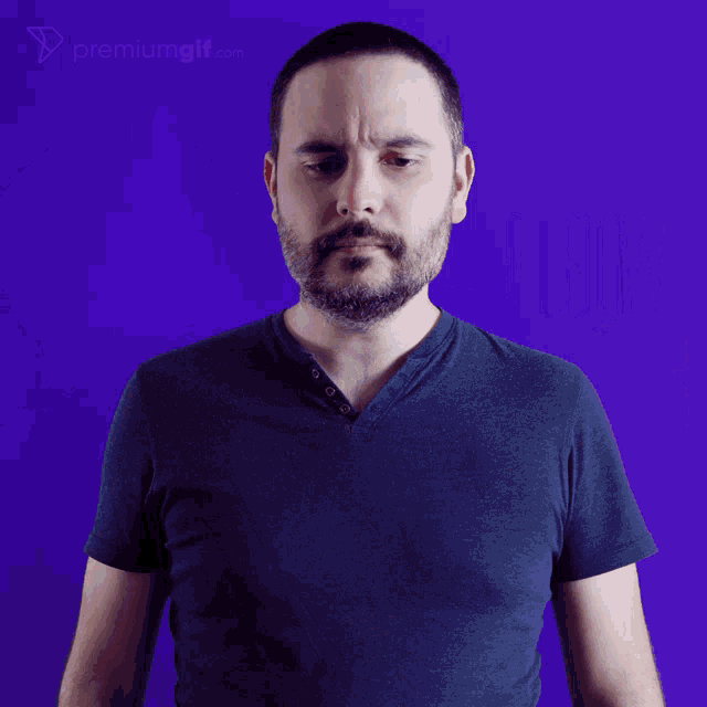 a man in a blue shirt stands in front of a blue background with the word elb written in yellow
