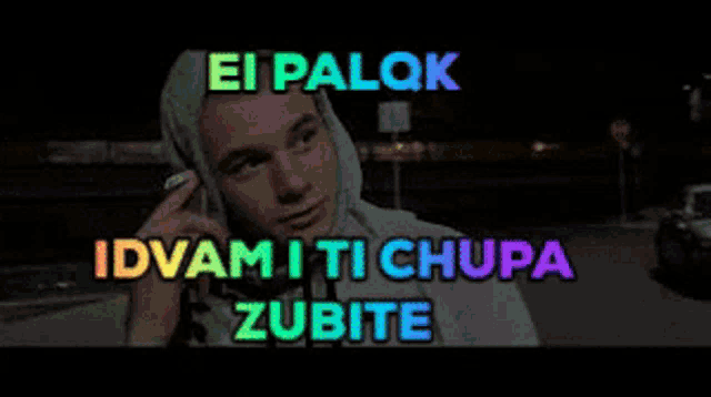 a man in a hoodie is talking on a cell phone with the words ei palok