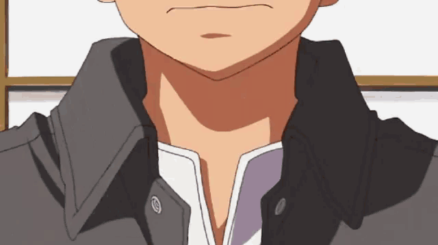 a close up of a man 's neck with a black jacket on