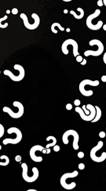 a black background with white question marks floating in the air