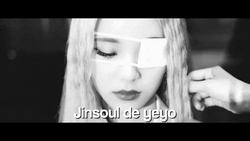 a black and white photo of a woman with a bandage on her eye and the words jinsoul de yeyo below her