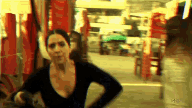 a blurry photo of a woman with the letters mca on the bottom