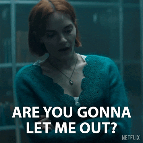a woman in a blue sweater is asking are you gonna let me out ?