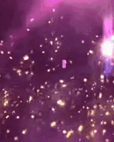 a girl is surrounded by purple lights and the word friends is visible