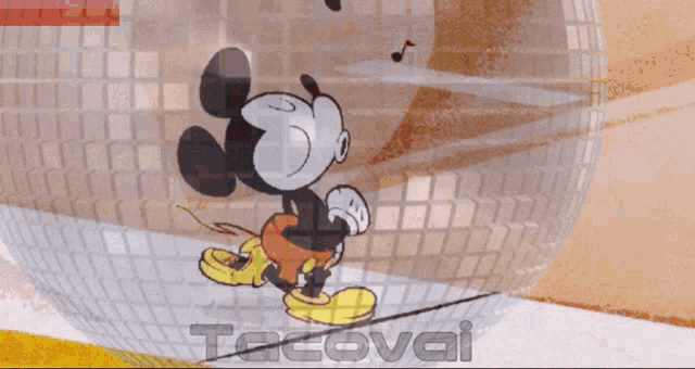 a cartoon of mickey mouse standing in front of a disco ball with tacovai written below him