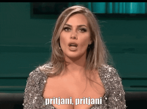 a woman in a silver dress says pritijani