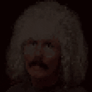 a pixelated image of a woman 's face with a white hat on