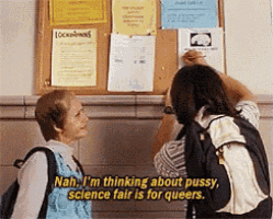two people looking at a bulletin board with a sign that says lock downs
