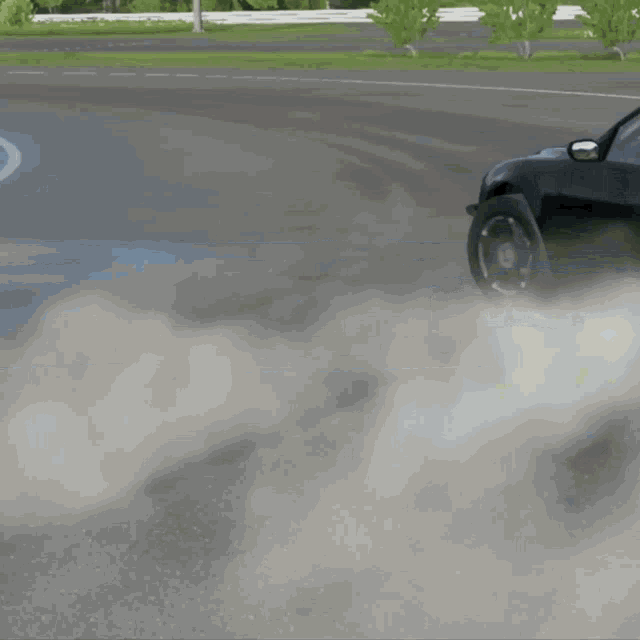 a car is driving down a road with a lot of smoke coming out of it