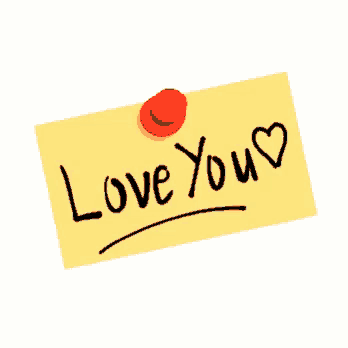 a sticky note that says love you with a red pin