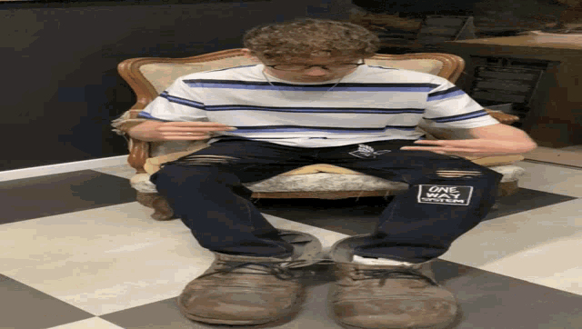 a person wearing a pair of jeans that say game over