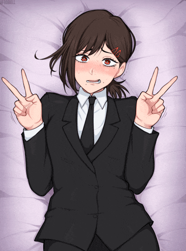 a girl in a suit and tie is laying on a bed and giving a peace sign
