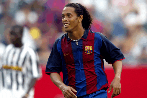 a soccer player wearing a jersey with the letter r on it