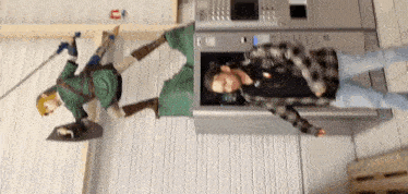 a man laying on the floor next to a statue of a knight