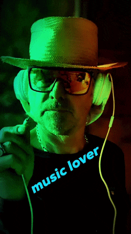a man wearing a straw hat and headphones has the word music lover on his shirt