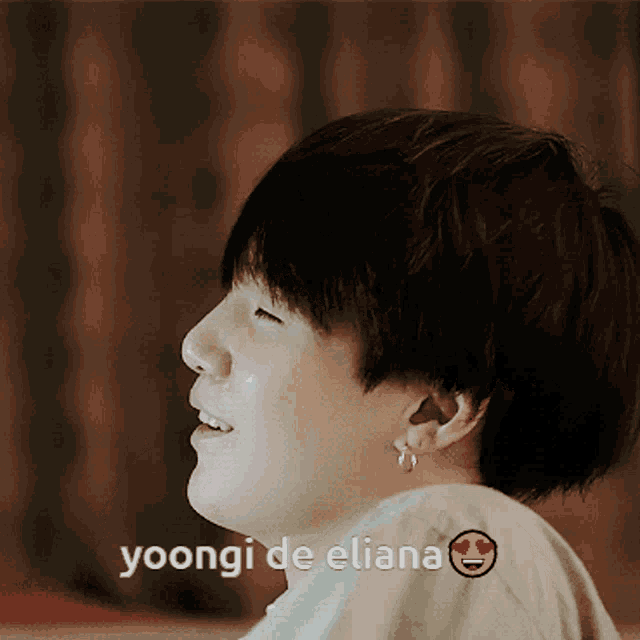 a close up of a person 's face with the words yoongi de eliana