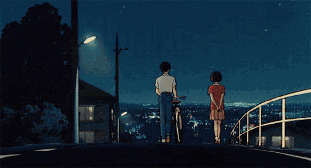 a man and a woman standing next to each other on a bridge at night