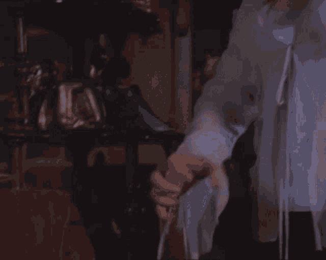a woman 's hand is visible in a blurry photo