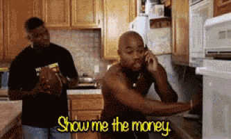 a man talking on a cell phone in a kitchen with the words show me the money below him