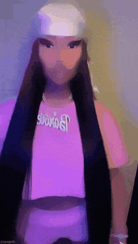 a woman wearing a purple shirt and a white headband with the word spaghetti on it