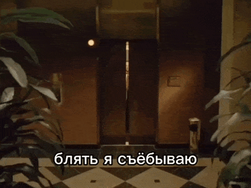 a hallway with a glass railing and a sign that says ' blahte '