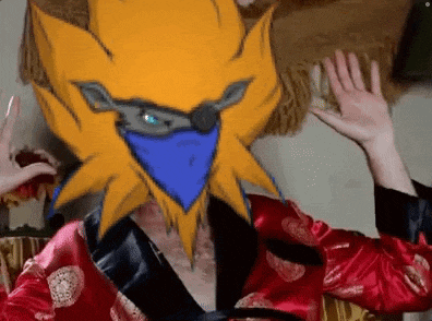 a person is wearing a red robe with a cartoon character on their head .