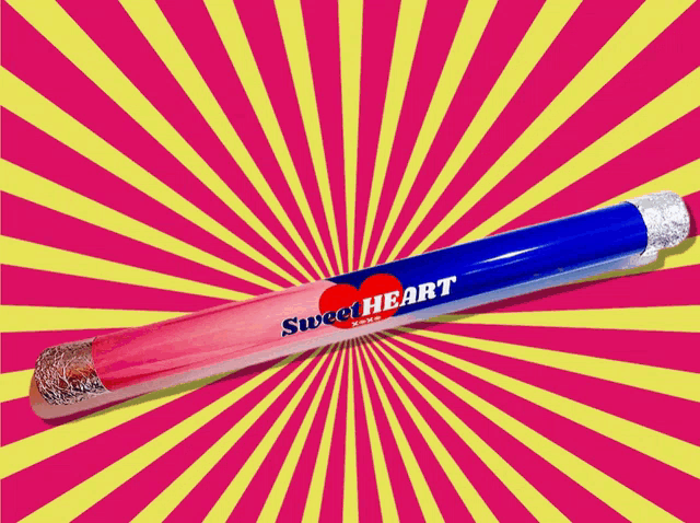 a bunch of sweetheart pencils on a pink surface
