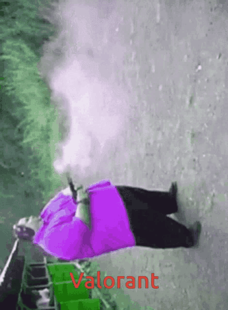 a man in a purple shirt is laying on the ground with smoke coming out of his mouth and the word valorant on the bottom