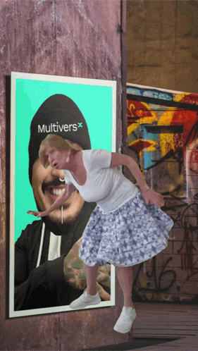a woman is standing in front of a poster that says multivers on it