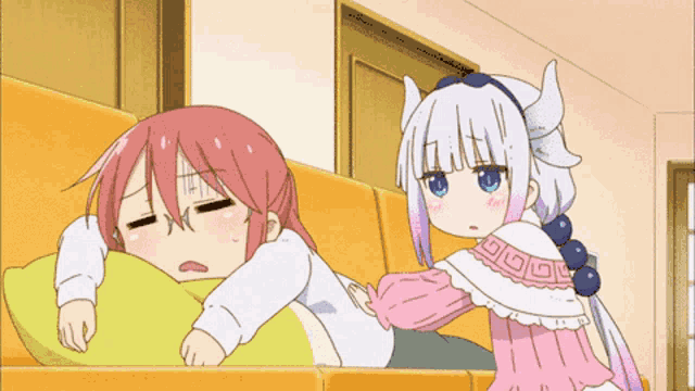 a cartoon of a girl laying on a pillow next to another girl with horns