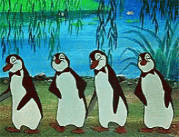 a group of penguins are standing in a row and smiling