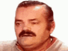 a man with a mustache is making a funny face with his eyes closed .