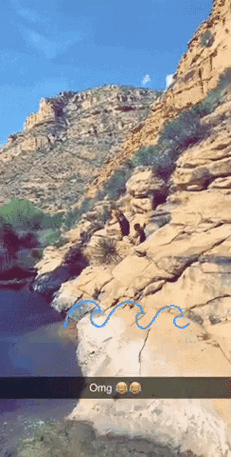 a snapchat of a person jumping off a cliff with the word omg below