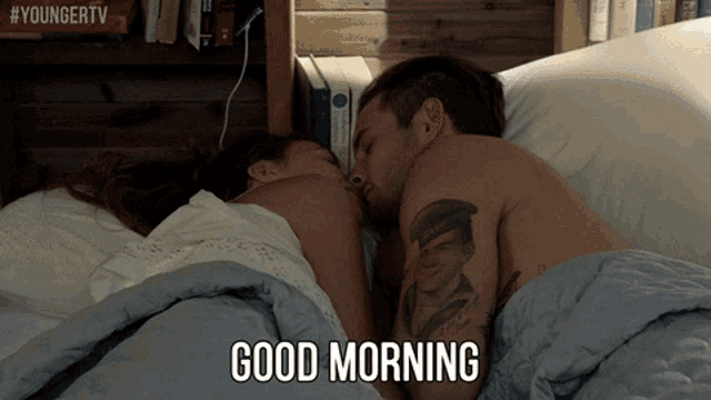 a man and a woman laying in bed with the words good morning written on the bottom