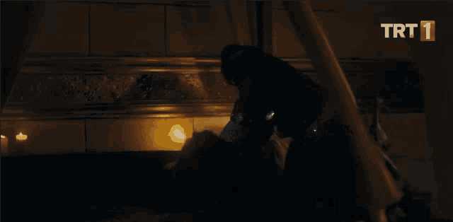 a dark room with a trt logo on the bottom right corner