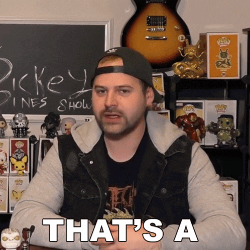 a man in a hat says that 's a in front of a blackboard