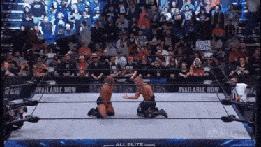 two wrestlers are in a ring with a sign that says available now