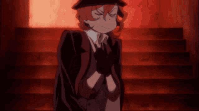 a man in a suit and hat is standing on a set of stairs with his eyes closed and smoking a cigarette .