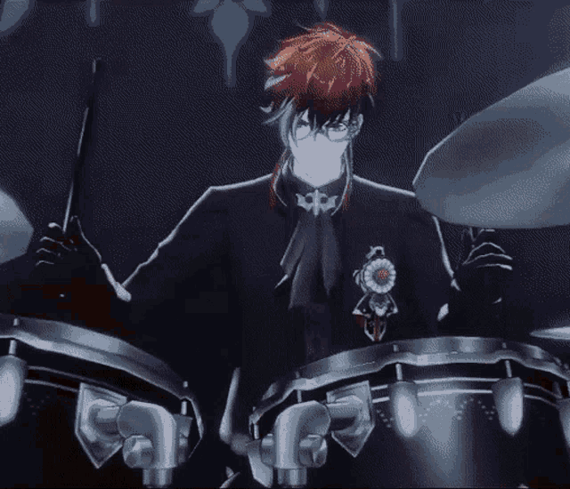 a man in a red hat is playing drums