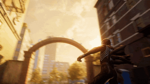 a man in a spiderman costume is walking through a city