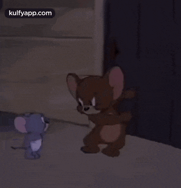 jerry and jerry from tom and jerry are standing next to each other on the ground .