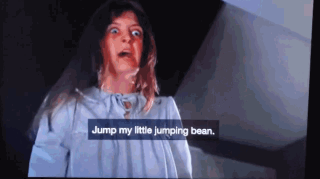 a girl in a white dress says jump my little jumping bean on a tv screen