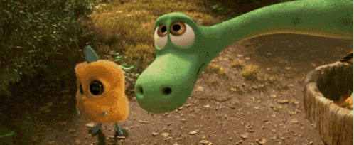 a dinosaur and a bird are looking at each other