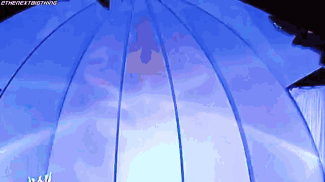 a blue dome with a triangle in the middle of it .
