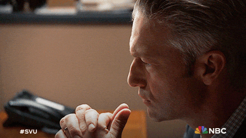 a close up of a man 's face with #svu on the bottom