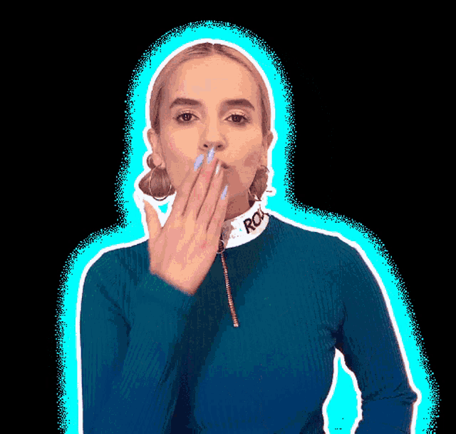 a woman wearing a blue sweater with the word rok on it