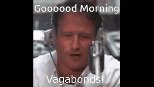 a man wearing headphones is talking into a microphone and says good morning vagabonds .
